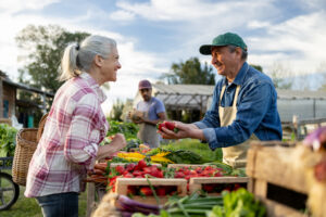 iStock 1941134987 Farmers interacting at a market.